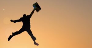 a person jumping with a suitcase